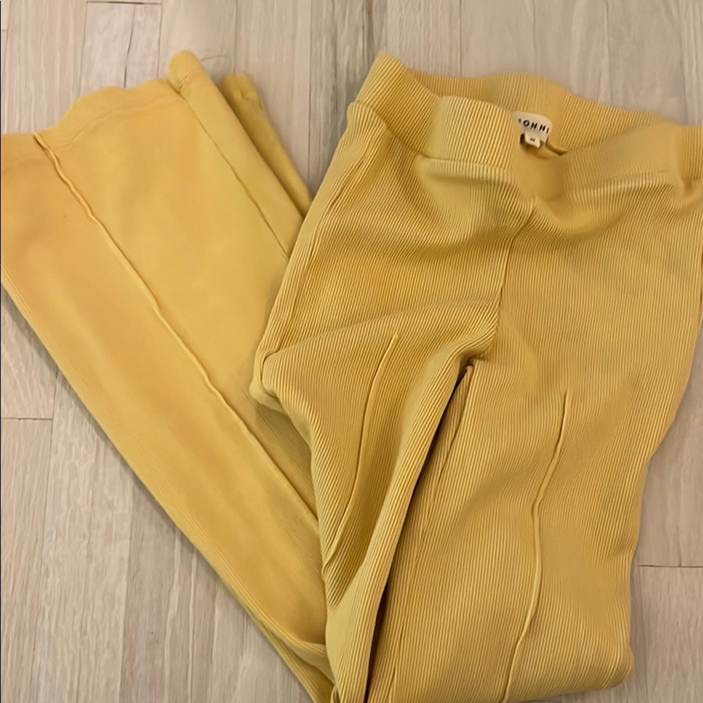 DONNI. rib kick flare in yellow, size xs